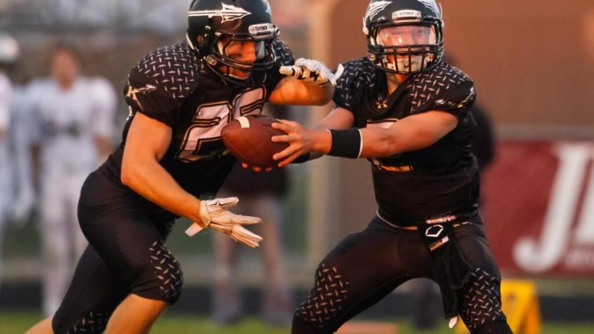 Quarterback Tyson Fuss, right, and running back Duston Taylor will help lead Kuna’s transition from the 4A classification to the 5A SIC.