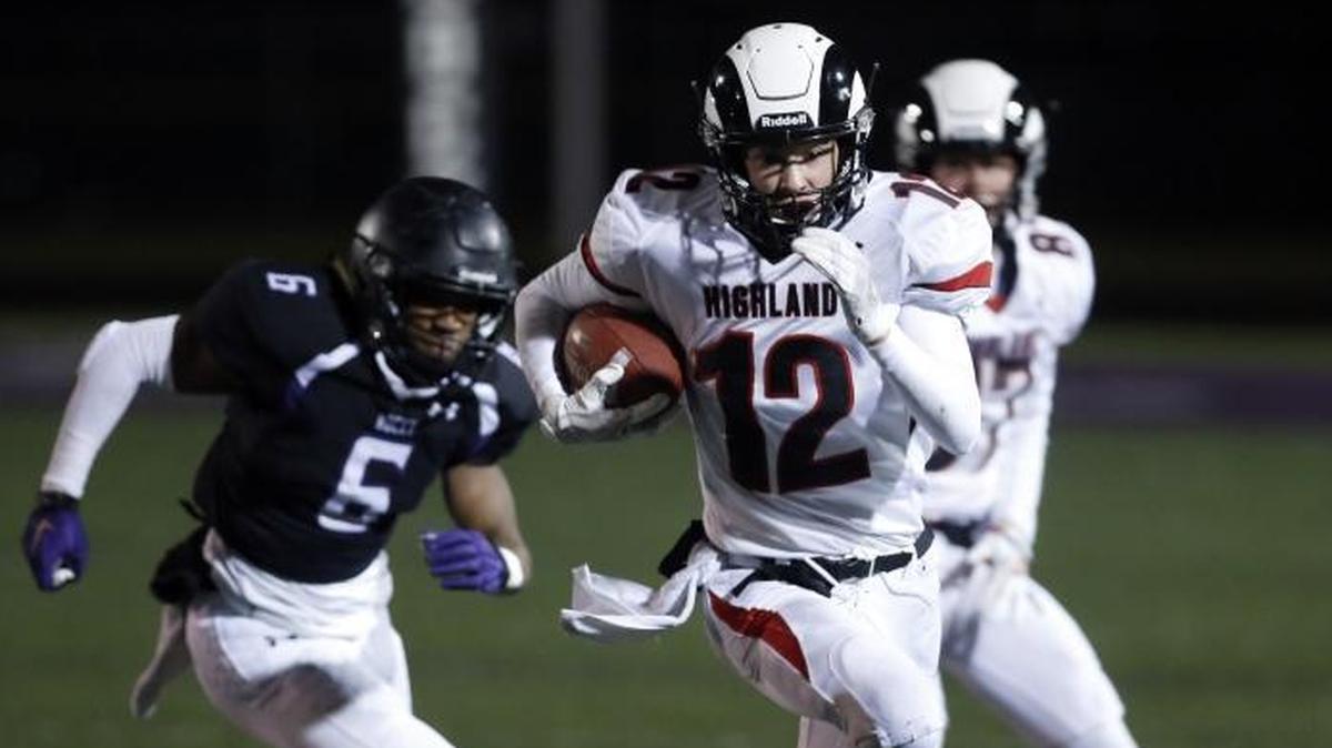 Highland’s Landon Demuzio breaks away from the Rocky Mountain defense in the 5A state football semifinals Nov. 10 at Rocky Mountain High.