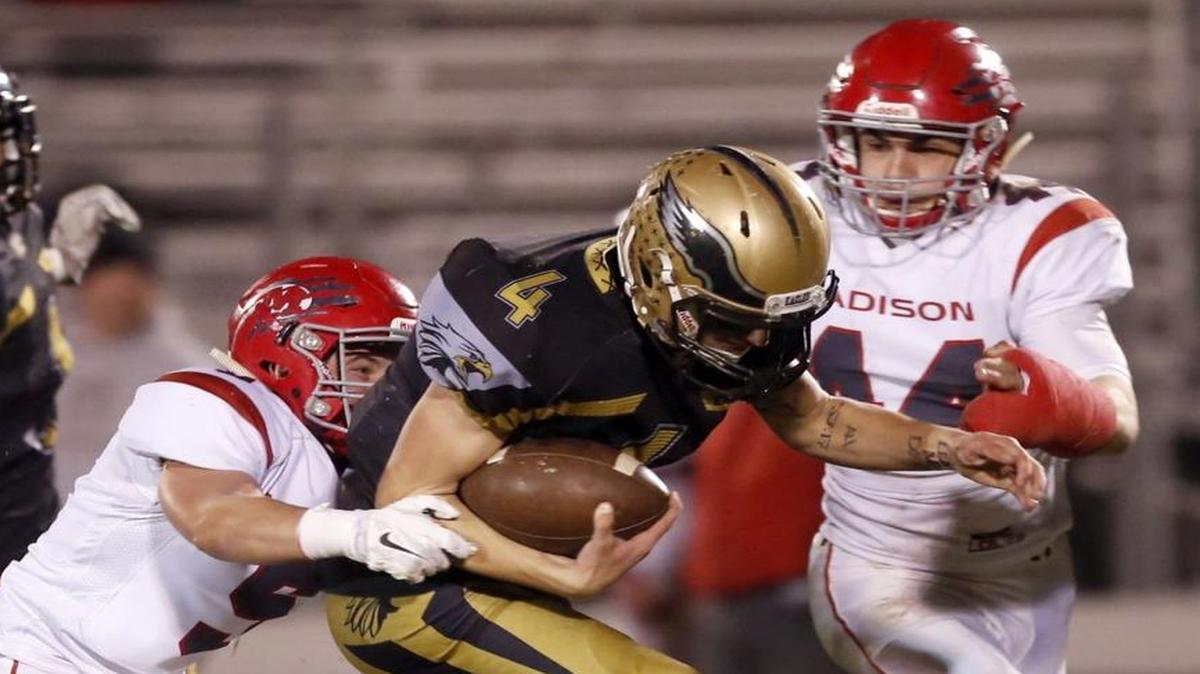 Capital’s Drew Korf heads upfield against Madison during the 5A state quarterfinals Friday night at Centennial High.