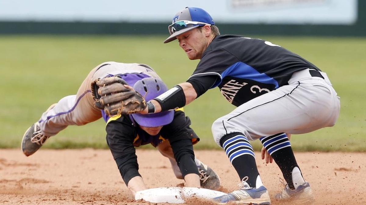 Lewiston’s Riley Way dives back to second base just before the tag from Timberline shortstop Parker Price during last season’s 5A state tournament. MaxPreps chose Price as Idaho’s top baseball player in a state-by-state preview.