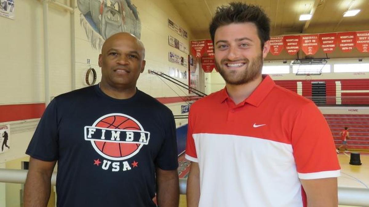 James Daye, left, and Evan Curry pose for a photo in the Nampa High gym. The school announced it hired Daye as its boys basketball coach and Curry as its girls soccer coach June 23. The school has rescinded both offers.
