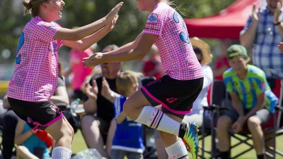 Mylee Carver, right, finds teammate Kathleen McGrath after scoring the tying goal in the Indie Chicas Lime U-13 girls soccer game with Santa Clara Sporting 02 Green (Calif.). The score kept the team alive in the second half Tuesday June 21, 2016 at Simplot Sports Complex in Boise.