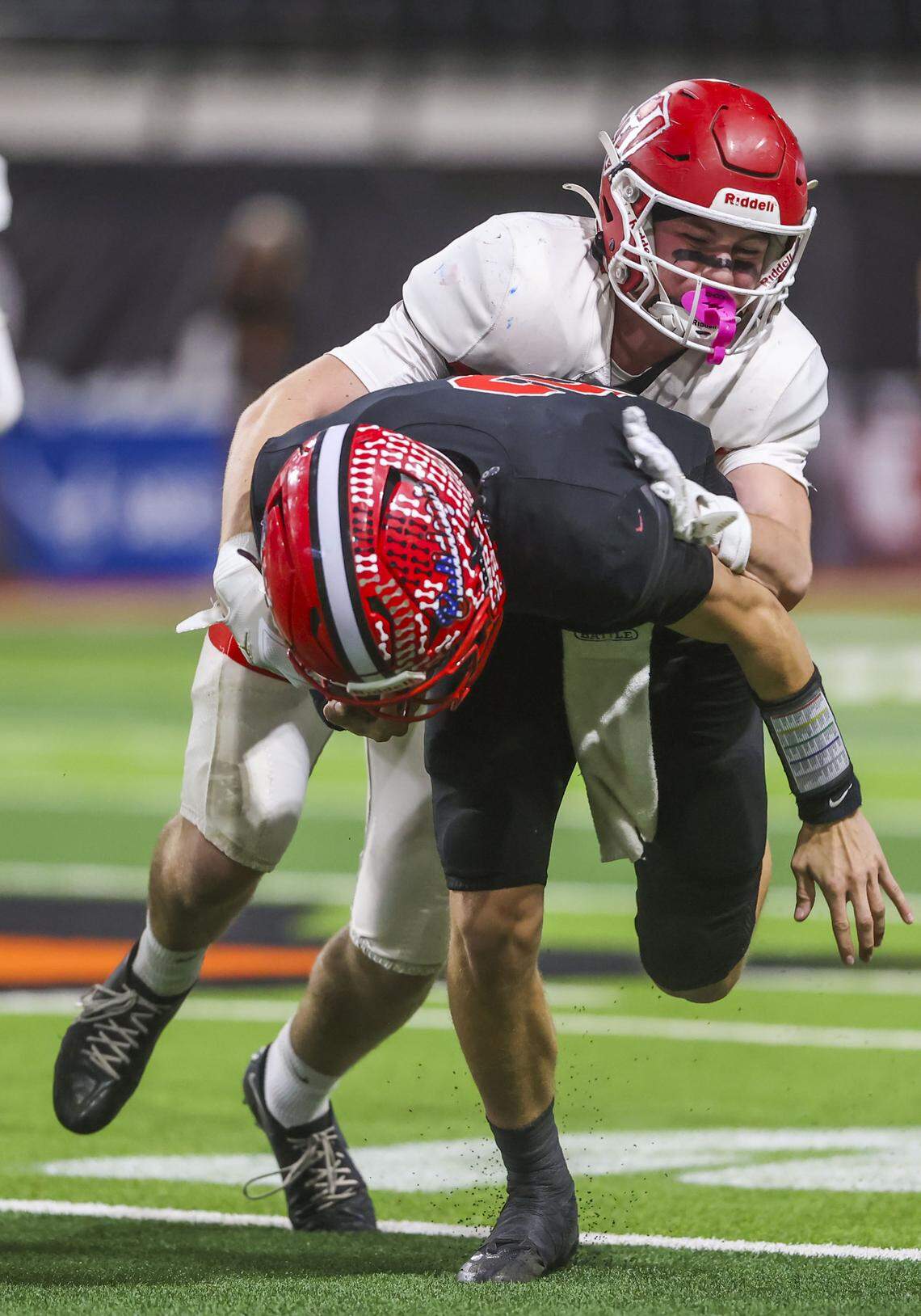 Homedale senior Lukas Hall tracks down Kimberly quarterback MaCraye Bruning in the 4A state championship Saturday.