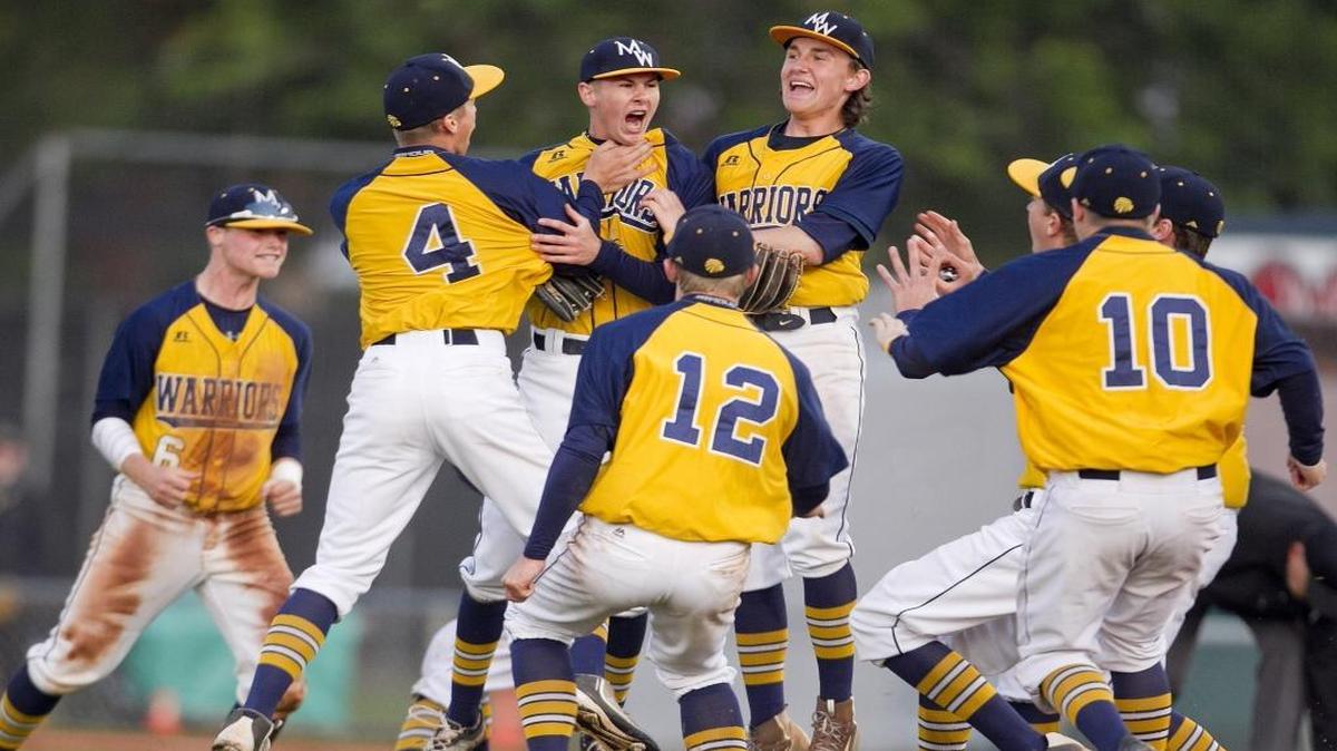 The Meridian High baseball team celebrates after the final out against Lewiston in the 5A state baseball semifinals May 20 at Memorial Stadium.