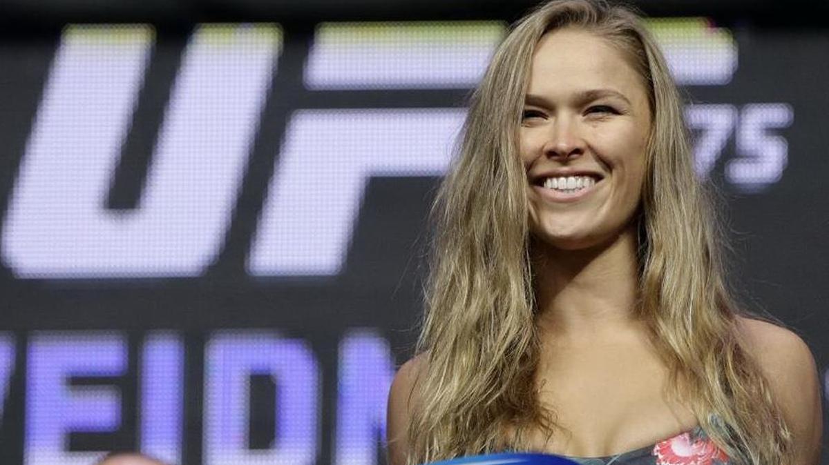 Ronda Rousey stands on the scale during a weigh-in for the UFC 175 mixed martial arts event at the Mandalay Bay in Las Vegas on July 4, 2014. She became engaged last week to fellow MMA fighter Travis Browne, who bought the ring in Boise.