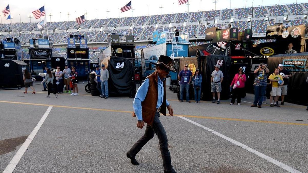 Brian Scott’s boss and NASCAR legend Richard Petty walks through the garage area Wednesday.