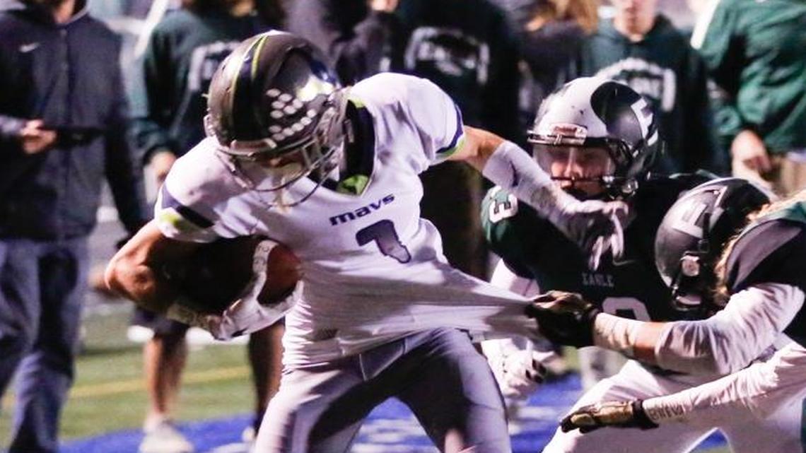 Mountain View’s Ty Haun tries to move the ball up the sideline after intercepting an Eagle pass in the end zone Friday night in Eagle.