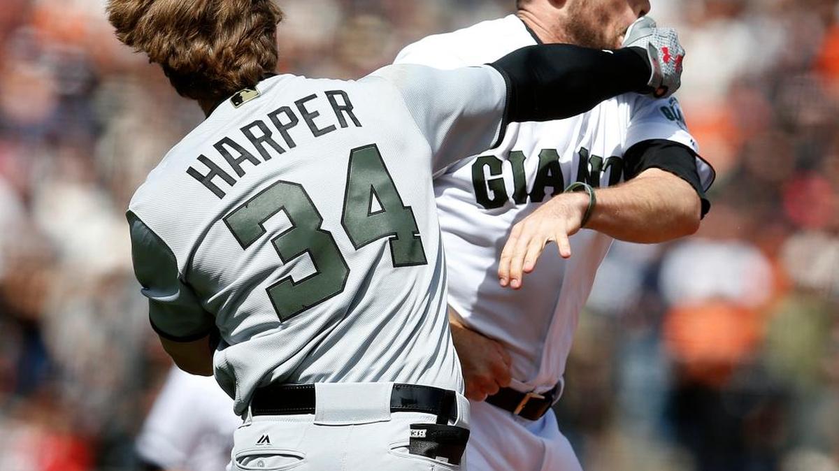 San Francisco Giants pitcher Hunter Strickland is punched by Washington Nationals’ Bryce Harper during the eighth inning on Monday in San Francisco, Calif. Harper was hit by a pitch from Strickland, starting a fight between the two teams.