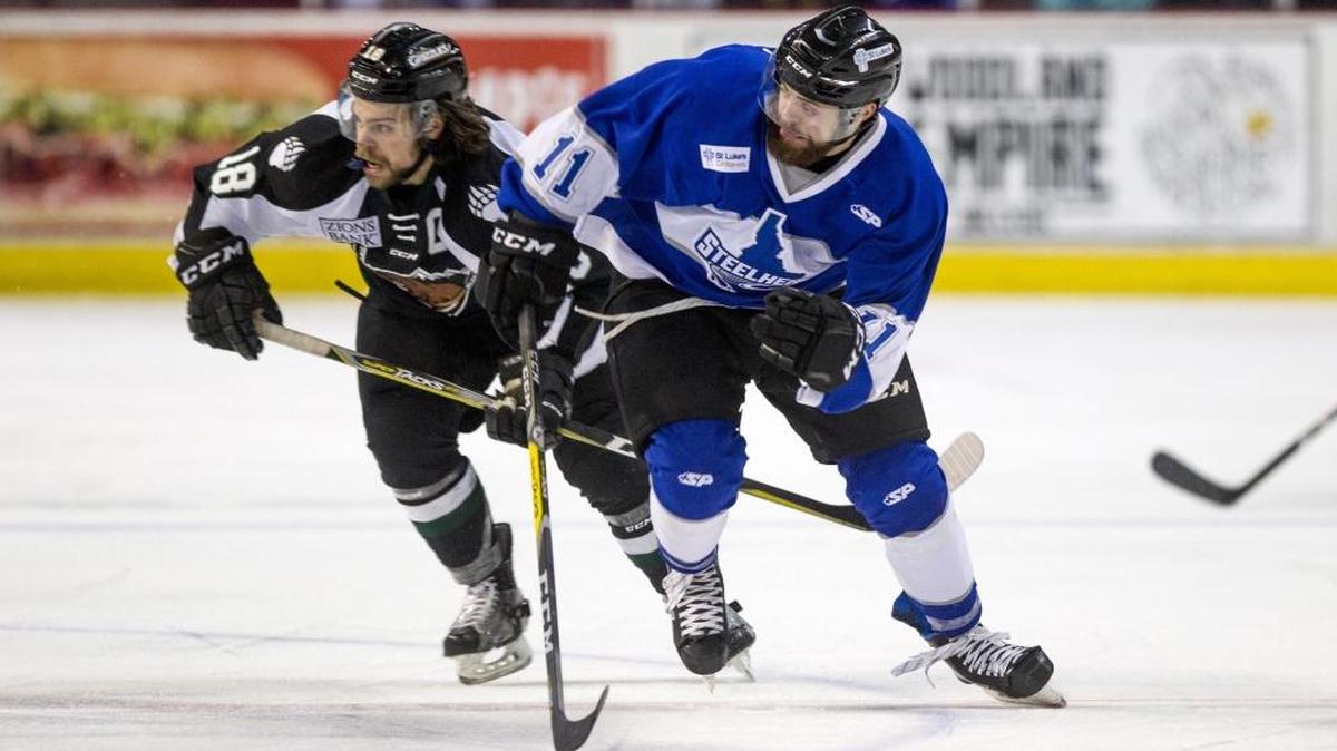 Idaho Steelheads forward Alexander Dahl, right, sprints for position on offense with Utah Grizzlies forward C.J. Eick in close pursuit Dec. 8 at CenturyLink Arena in Boise.