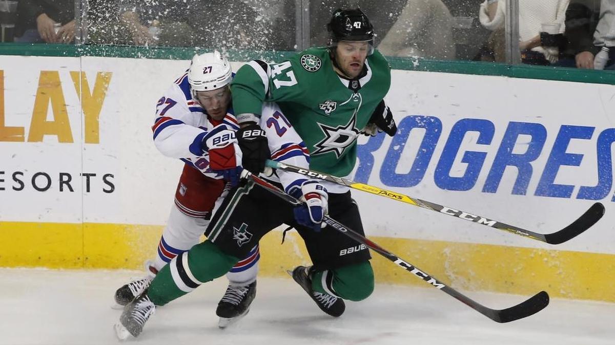 New York Rangers defenseman Ryan McDonagh and Dallas Stars right wing Alexander Radulov collide during the third period of an NHL hockey game Feb. 5, 2018, in Dallas.