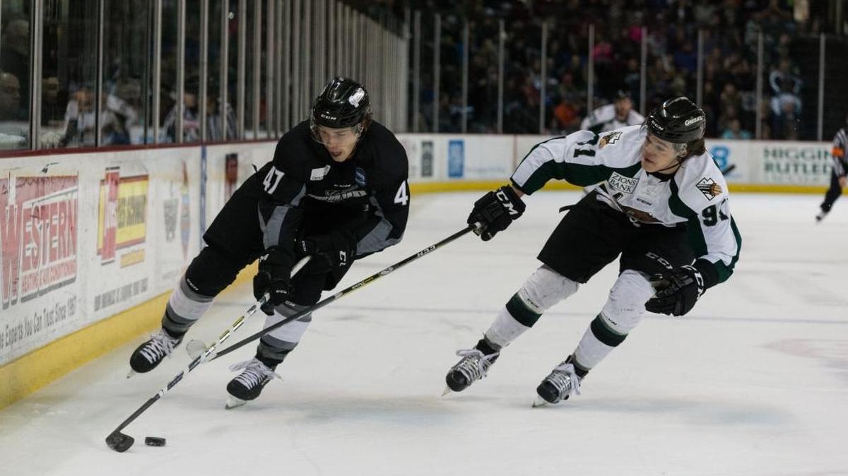 Idaho winger Connor Chatham tries to control the puck against the Utah Grizzlies in February at CenturyLink Arena. He is a Steelheads player for the third season in a row.