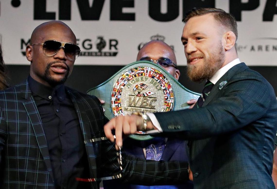Floyd Mayweather Jr., left, and Conor McGregor pose during a news conference Aug. 23 in Las Vegas.