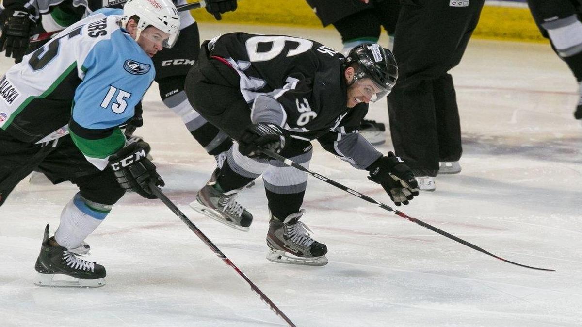 Idaho Steelheads forward Colton Beck chases the puck with Alaska’s Ryan Walters during an April 1, 2015, game at CenturyLink Arena.