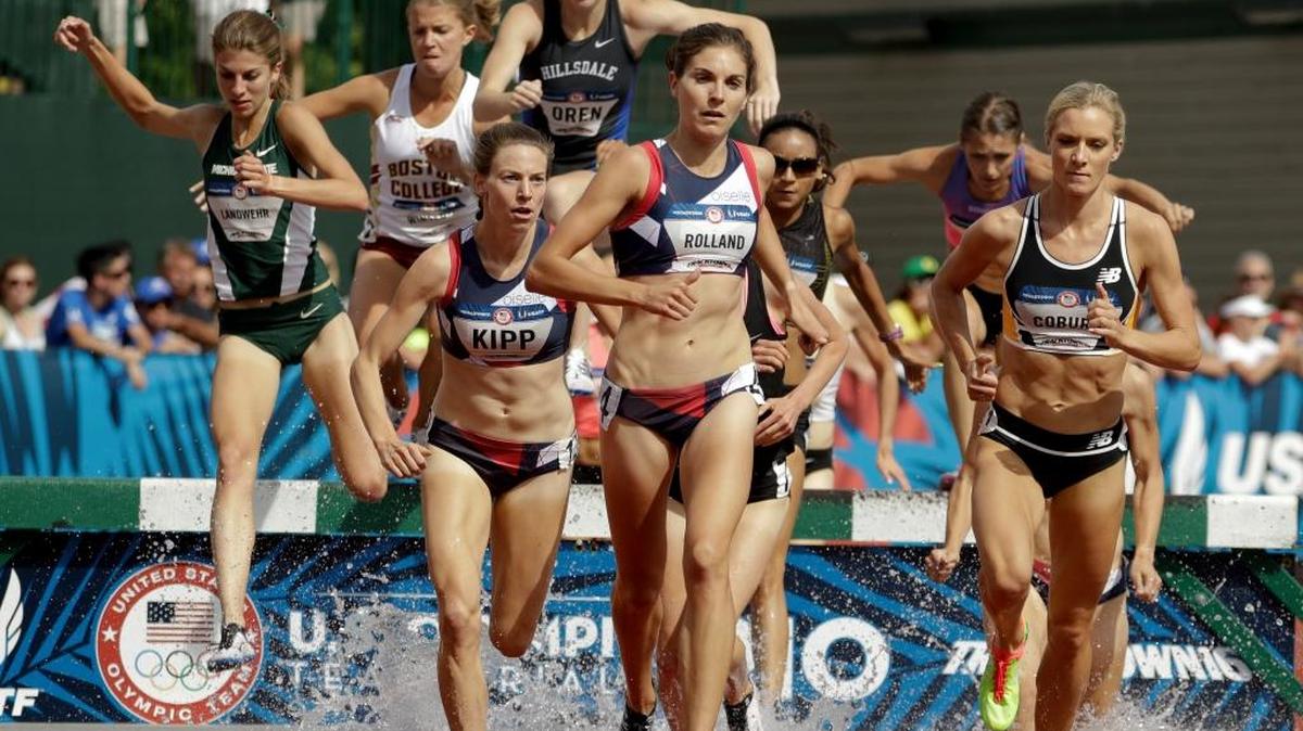 Megan Rolland, center, competes in a women’s 3,000-meter steeplechase heat at the U.S. Olympic Track and Field Trials on Monday, July 4, 2016, in Eugene, Ore. Rolland finished second in the heat to Emma Coburn, right.