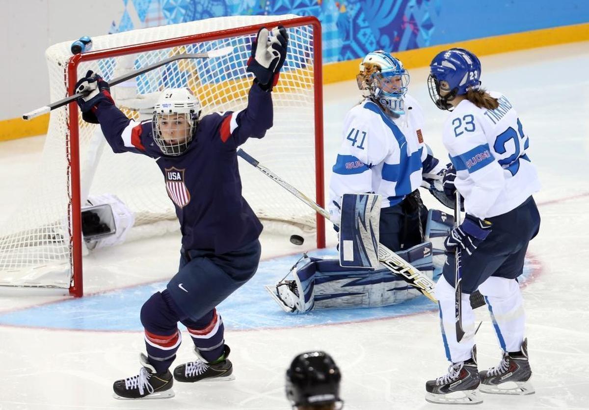 U.S. forward Hilary Knight scores a goal against Finland goaltender Noora Raty during the 2014 Olympics in Russia.