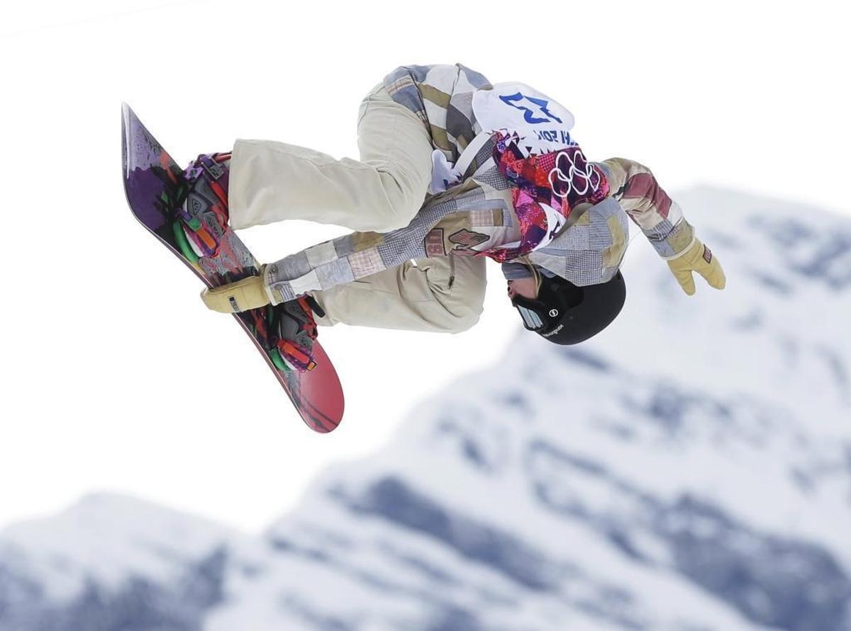 Jessika Jenson of Rigby takes a jump during the women’s snowboard slopestyle semifinal at the 2014 Winter Olympics in Russia.