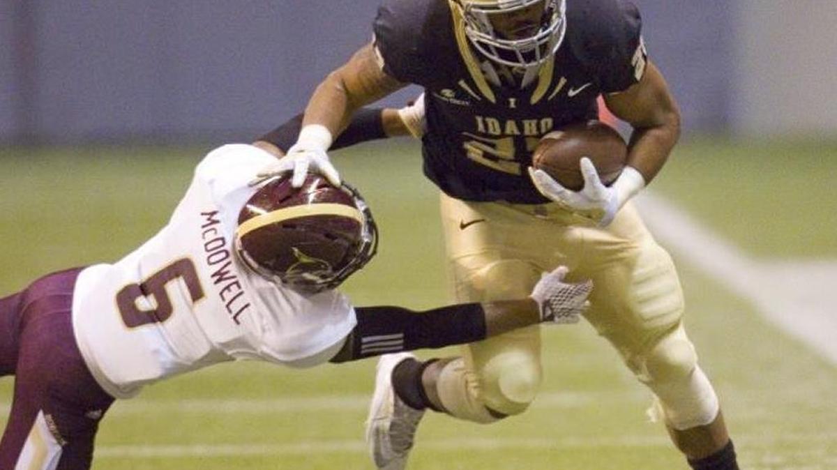 Idaho running back Elijhaa Penny tries to break a tackle against Texas State in a Sun Belt Conference game at the Kibbie Dome in Moscow last season.