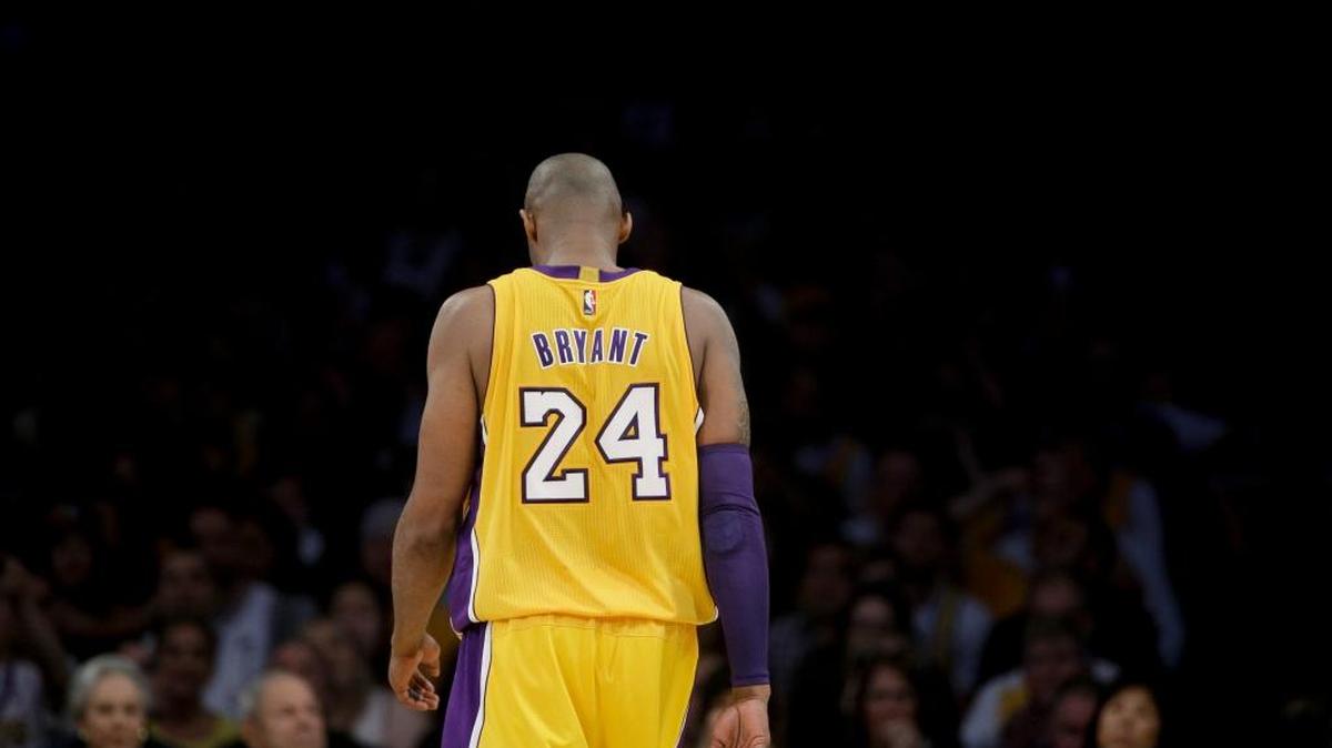 Los Angeles Lakers forward Kobe Bryant walks down the court during his final game.