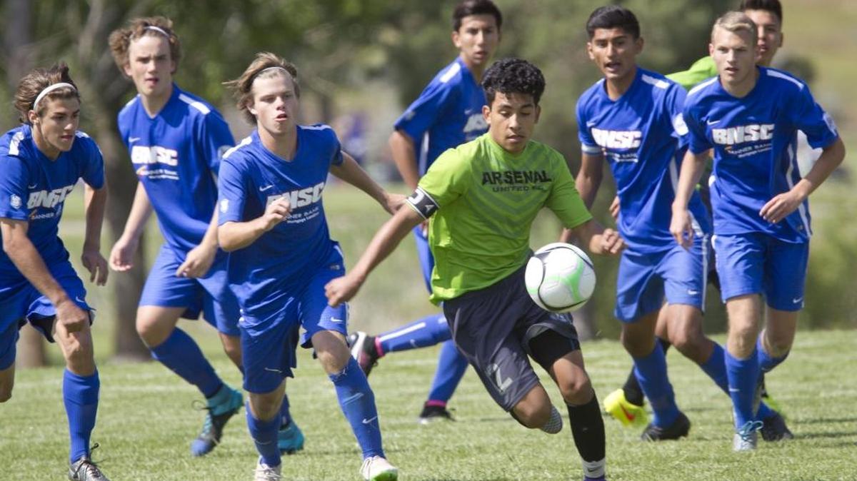 Arsenal United Knights’ Guadalupe Barajas moves the ball under pressure from Boise Nationals Inter players during a U17 boys game Saturday at the Idaho State Cup soccer tournament at Simplot Sports Complex.