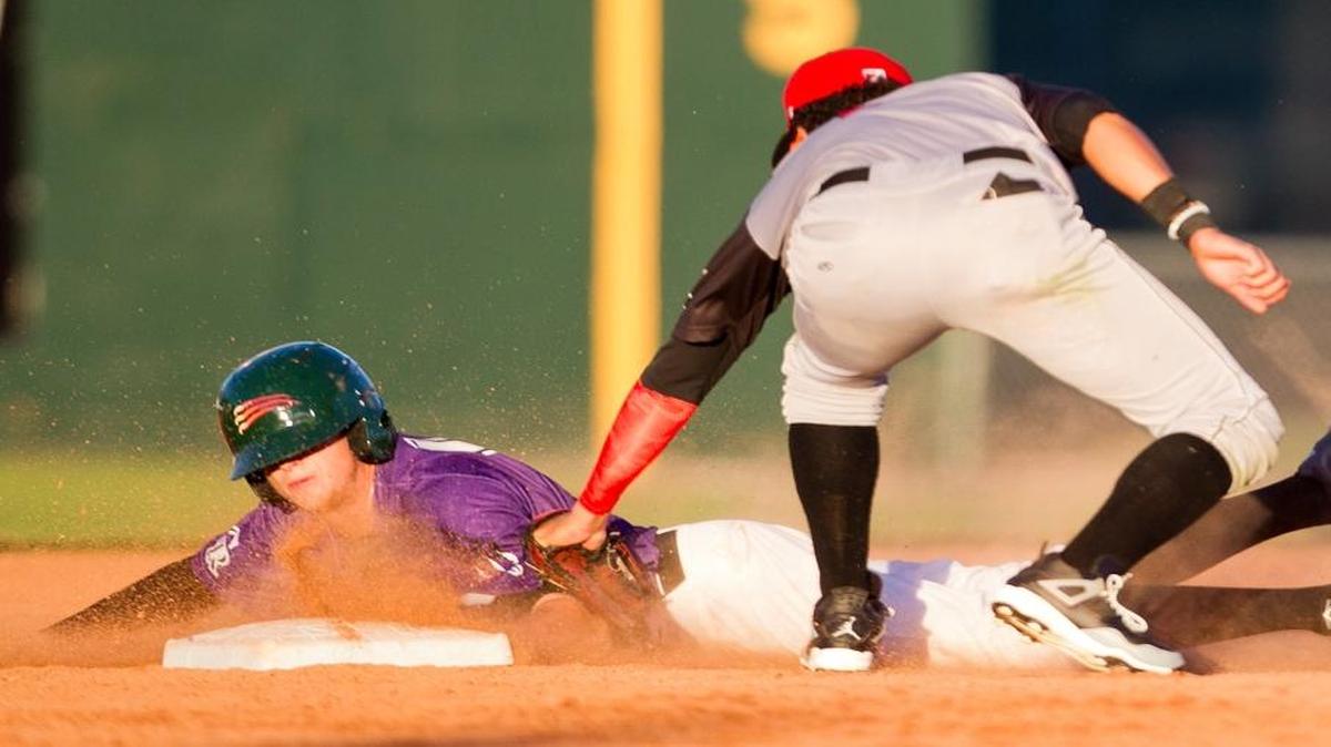 Boise Hawks outfielder Steven Linkous is tagged out at second by Salem-Keizer’s Kevin Rivera during Opening Day at Memorial Stadium.