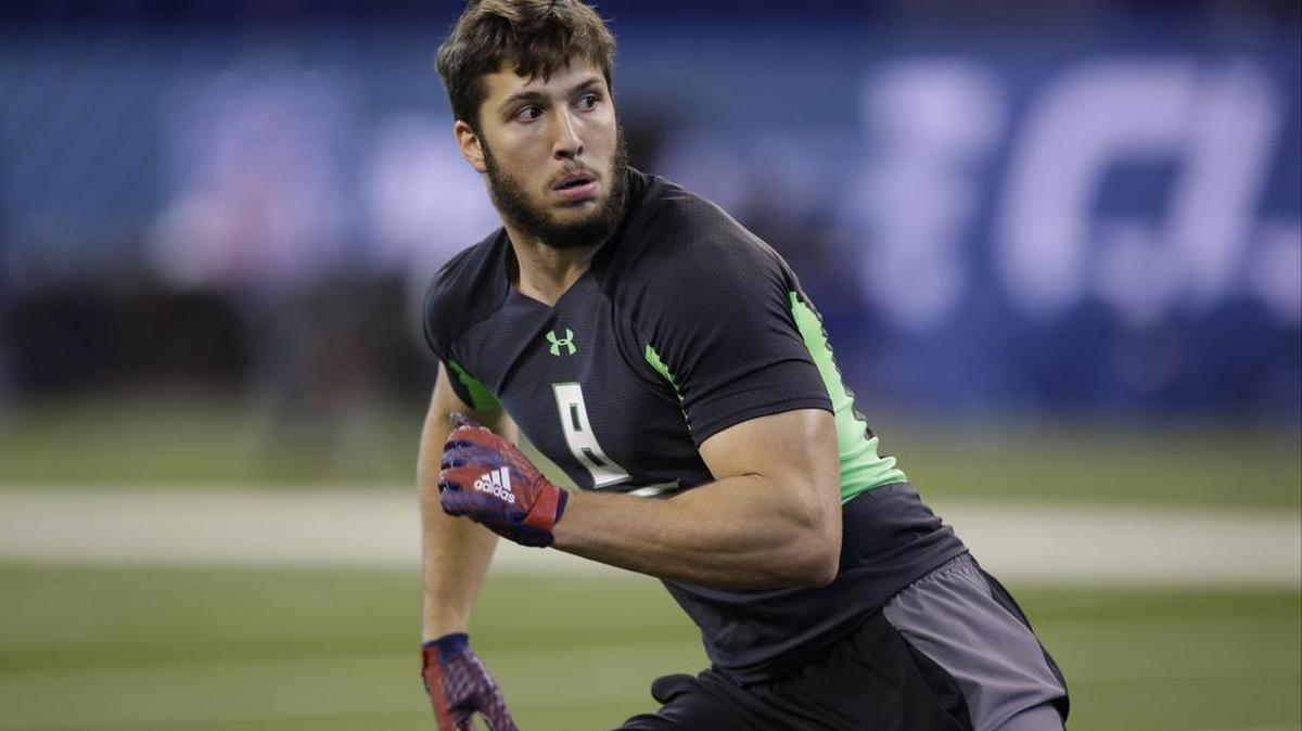 Former Utah State linebacker Kyler Fackrell runs a drill at the NFL scouting combine on Sunday, Feb. 28, 2016, in Indianapolis.