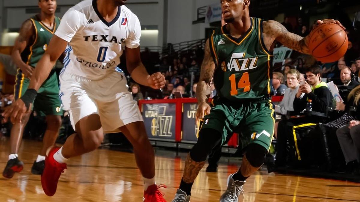 Idaho’s Pierre Jackson controls the ball against Tu Holloway of the Texas Legends on Saturday night at CenturyLink Arena. The Stampede wore Jazz jerseys for Utah Jazz Affiliation Night.