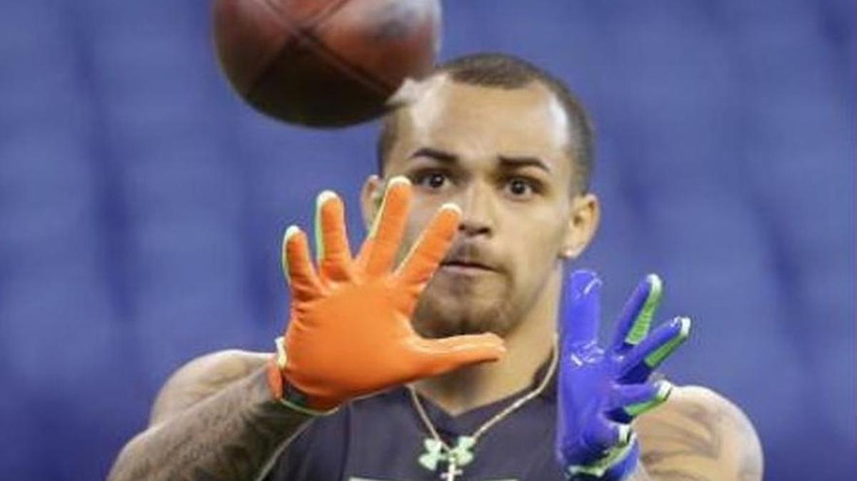 Former Boise State safety Darian Thompson eyes the ball as he makes a catch during on-field drills Monday at the NFL Scouting Combine in Indianapolis.