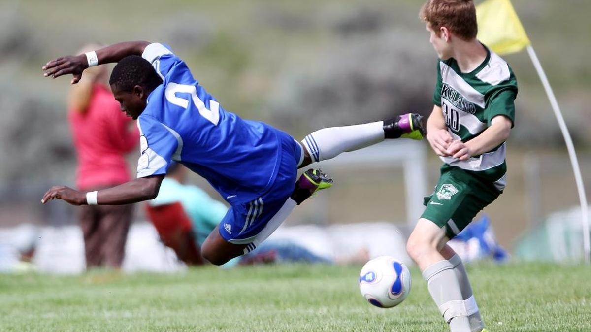 Idaho Rush’s Manasse Mbuyi, left, gets fouled by the Lakeland Nighhawks’ Brandon Barber during the 2015 Idaho State Cup soccer tournament at the Simplot Sports Complex in Boise.