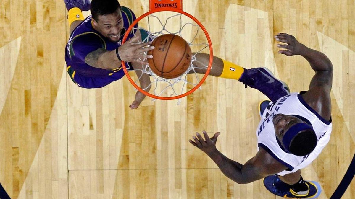 New Orleans Pelicans guard Bryce Dejean-Jones slam dunks against Memphis Grizzlies forward Zach Randolph on Feb. 1 in New Orleans.